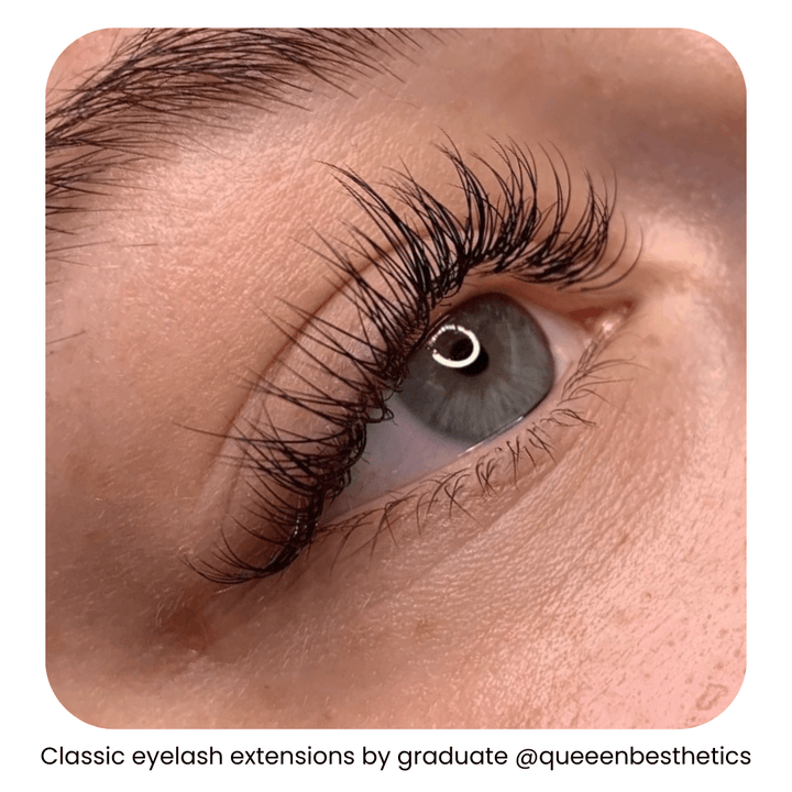 Woman’s eye with classic eyelash extensions done by a graduate of IBI’s eyelash extension training online program.